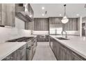 A chef's dream kitchen, featuring a spacious island, professional appliances, and modern cabinetry at 8730 E Tether Trl, Scottsdale, AZ 85255