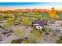 Picturesque property featuring desert landscaping, views of the golf course and mountains in the background at 11801 N Sundown Dr, Scottsdale, AZ 85260