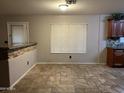 Dining area with tile flooring and bar-height counter at 12733 W Boca Raton Rd, El Mirage, AZ 85335