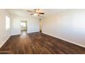 Spacious living room with warm wood floors, natural light, and an inviting atmosphere at 2027 W Monte Vista Rd, Phoenix, AZ 85009