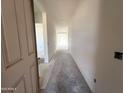Bright entryway featuring a long hallway with white walls, leading to a well-lit area at the end at 22961 E Twin Acres Dr, Queen Creek, AZ 85142