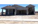 Exterior view of the home featuring a stucco finish, tile roof, and a 3-car garage, showcasing its modern design at 22961 E Twin Acres Dr, Queen Creek, AZ 85142
