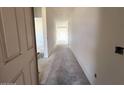 Bright hallway leading to various rooms with fresh, neutral paint and potential for customization at 22961 E Twin Acres Dr, Queen Creek, AZ 85142