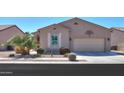 Charming single-story home with desert landscaping, tan stucco, and attached two-car garage at 2643 E San Ricardo Trl, Casa Grande, AZ 85194