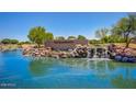 Scenic view of the San Tan Heights community entrance with cascading waterfalls and lush landscaping at 2725 W Silver Creek Ln, San Tan Valley, AZ 85144