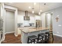 Beautiful kitchen boasts granite countertops, a kitchen island with seating, and stainless steel appliances at 4088 E Comstock Dr, Gilbert, AZ 85296