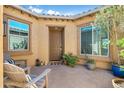 Cozy front courtyard with seating area and decorative plants, creating a welcoming entrance at 5334 S Parkwood --, Mesa, AZ 85212