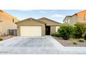 Charming single-story home featuring a well-manicured front yard and an attached two-car garage at 559 W Magena Dr, San Tan Valley, AZ 85140