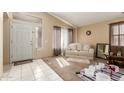 Inviting living room with tile entry, neutral paint, and ample natural light at 7808 W Palo Verde Dr, Glendale, AZ 85303