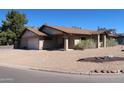 Beautiful single-story home with an attached garage and desert landscaping at 11406 W Montana Ave, Youngtown, AZ 85363