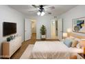 Cozy bedroom featuring a ceiling fan, walk-in closet, and en-suite bathroom at 1942 S Emerson -- # 217, Mesa, AZ 85210