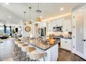 Modern kitchen featuring an island with barstool seating, stainless steel appliances, and ample counter space at 1950 E Lantana Dr, Chandler, AZ 85286