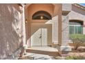 Inviting home entryway featuring double doors, decorative lighting, and an arched transom window at 1980 N Santa Fe Ct, Casa Grande, AZ 85122