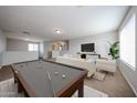 Upstairs game room featuring comfortable seating area and a pool table at 22473 W Woodlands Ave, Buckeye, AZ 85326