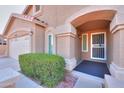 Welcoming front entrance with a secure screen door and well-maintained landscaping at 3602 E Mountain Sky Ave. --, Phoenix, AZ 85044