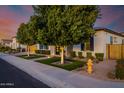 Inviting home with manicured front yard, mature trees, and a stylish brick and stucco facade at 4191 S Emerald Dr, Chandler, AZ 85249