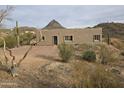 Exterior view of a desert home with native vegetation and mountain backdrop at 46312 N 38Th Ave, New River, AZ 85087