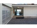 Contemporary home featuring a clear glass front door with a view of the horizon at 4959 E Red Rock Dr, Phoenix, AZ 85018