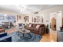 Inviting living room with hardwood floors, a ceiling fan, and comfortable seating arrangement at 5526 E Cicero St, Mesa, AZ 85205