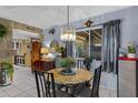 Bright dining room features a modern chandelier and views of the back patio at 5848 W Gelding Dr, Glendale, AZ 85306