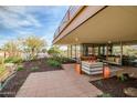 Spacious covered patio featuring lounge seating, modern fixtures, and stunning landscaped perimeter at 7167 E Rancho Vista Dr # 4006, Scottsdale, AZ 85251