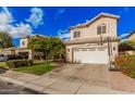 Inviting two-story home with a two-car garage, tile roof, and well-maintained landscaping at 7520 S Jentilly Ln, Tempe, AZ 85283