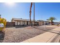 Single-story home with desert landscaping, a driveway, and an attached garage at 10533 W Lawrence Ln, Peoria, AZ 85345
