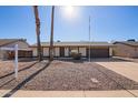 Traditional single-story home with a well-maintained front yard and a welcoming entrance at 10533 W Lawrence Ln, Peoria, AZ 85345