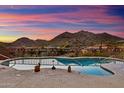 Backyard pool with stunning mountain views, desert landscaping, and privacy fence; perfect for relaxing and entertaining at 12770 N 145Th Way, Scottsdale, AZ 85259