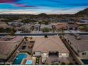 Backyard view of a well-maintained home with a pool, spa, and outdoor living space at 1319 N Chatsworth St, Mesa, AZ 85207