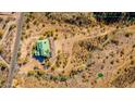 Aerial view of a desert home and property outlined in blue showing mature desert landscaping at 14426 N Vista Del Oro --, Scottsdale, AZ 85264