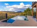 Stunning infinity pool with desert views and lush landscaping create a serene outdoor oasis at 14426 N Vista Del Oro --, Scottsdale, AZ 85264