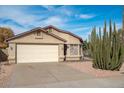 Home with a neutral color palette, a 2-car garage, and desert landscaping for low maintenance at 15002 W Heritage Oak Way, Surprise, AZ 85374