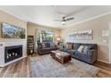 Bright living room with fireplace, comfortable sofas, and ample natural light, creating an inviting living space at 15095 N Thompson Peak Pkwy # 1053, Scottsdale, AZ 85260