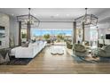 Bright living room with stylish furnishings, expansive sliding glass doors, and a welcoming atmosphere at 17801 W Mountainair St, Surprise, AZ 85388