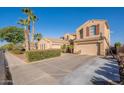 Beautiful two-story stucco home with a large driveway, three car garage and basketball hoop at 1970 E Lafayette Ave, Gilbert, AZ 85298
