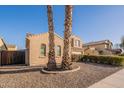 Charming stucco home with well-maintained gravel landscaping and a basketball hoop visible in the driveway at 1970 E Lafayette Ave, Gilbert, AZ 85298