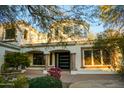 Beautiful home with desert landscaping, columns, and a welcoming entryway at 22339 N 77Th Way, Scottsdale, AZ 85255