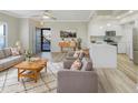 Inviting open-plan living room featuring modern decor and an adjoining updated kitchen at 295 N Rural Rd # 128, Chandler, AZ 85226