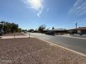 Neighborhood street view of a neighborhood with single-story homes and desert landscaping at 4621 N 47Th Dr, Phoenix, AZ 85031