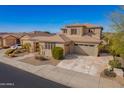 Beautiful two-story home with a well-maintained lawn, desert landscaping, and a spacious driveway leading to a two-car garage at 6844 W Mazatzal Dr, Peoria, AZ 85383