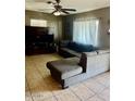 Comfortable living room features a large sectional couch and entertainment center at 1621 N 38Th Dr, Phoenix, AZ 85009