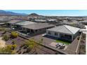 Aerial view of the community showing fenced yards, desert landscaping, and mountain views at 17878 W Amber Ridge Way, Goodyear, AZ 85338