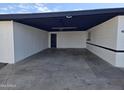 Spacious covered carport featuring painted brick walls and black trim, offering ample parking and protection at 1835 E Atlanta Ave, Phoenix, AZ 85040