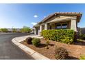 Charming single-story home with beautiful landscaping and a well-manicured lawn on a sunny day at 19982 W Glenrosa Ave, Litchfield Park, AZ 85340