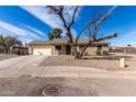 Charming single-story home with a low maintenance yard and attached two-car garage at 200 E Hess Ave, Coolidge, AZ 85128