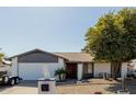 Charming single-story home featuring desert landscaping and a well-maintained front yard at 2143 W Eugie Ave, Phoenix, AZ 85029