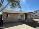 Cozy home featuring desert landscaping and a covered porch at 2837 W Almeria Rd, Phoenix, AZ 85009