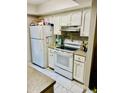 Functional kitchen with white appliances and ample cabinet space at 3131 W Cochise Dr # 157, Phoenix, AZ 85051