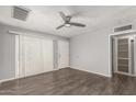 Well lit living room offering modern ceiling fan and hardwood floors at 4205 N 3Rd Ave, Phoenix, AZ 85013